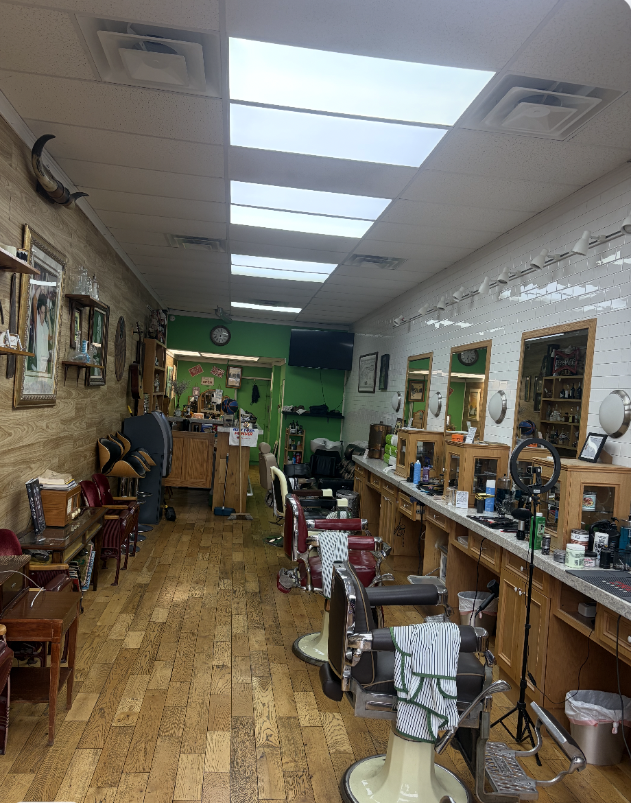 Inside The Silent Barber &mdash; the row of chairs down the mirror wall
